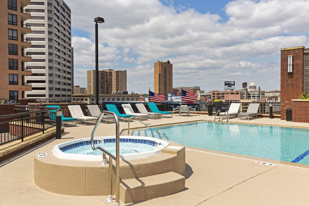 a pool and hot tub on the rooftop of one of the apartments in St. Paul called Galtier Towers