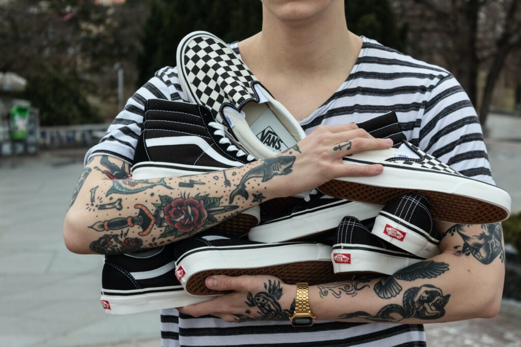 person holding shoes in their arms