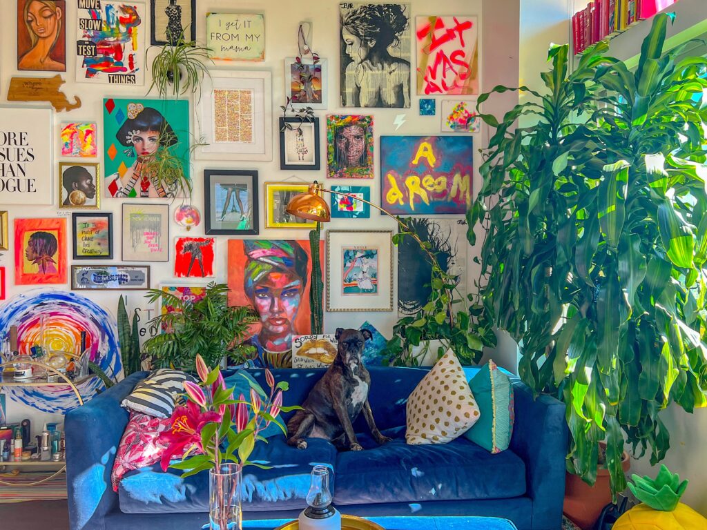bright and colorful maximalism living room with a dog on the blue couch